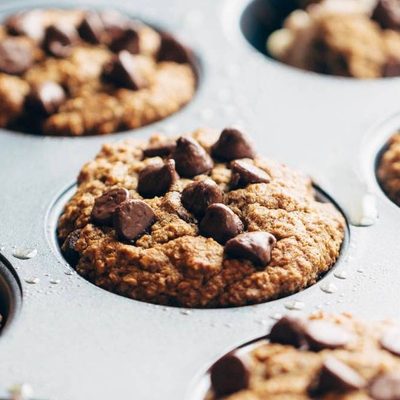 Banana Bread Muffins spread with butter.