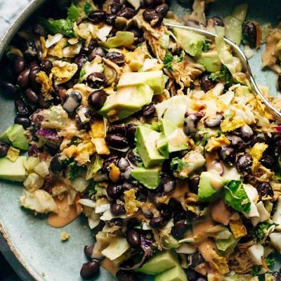 Cheater's Power Salad in bowl with hands.