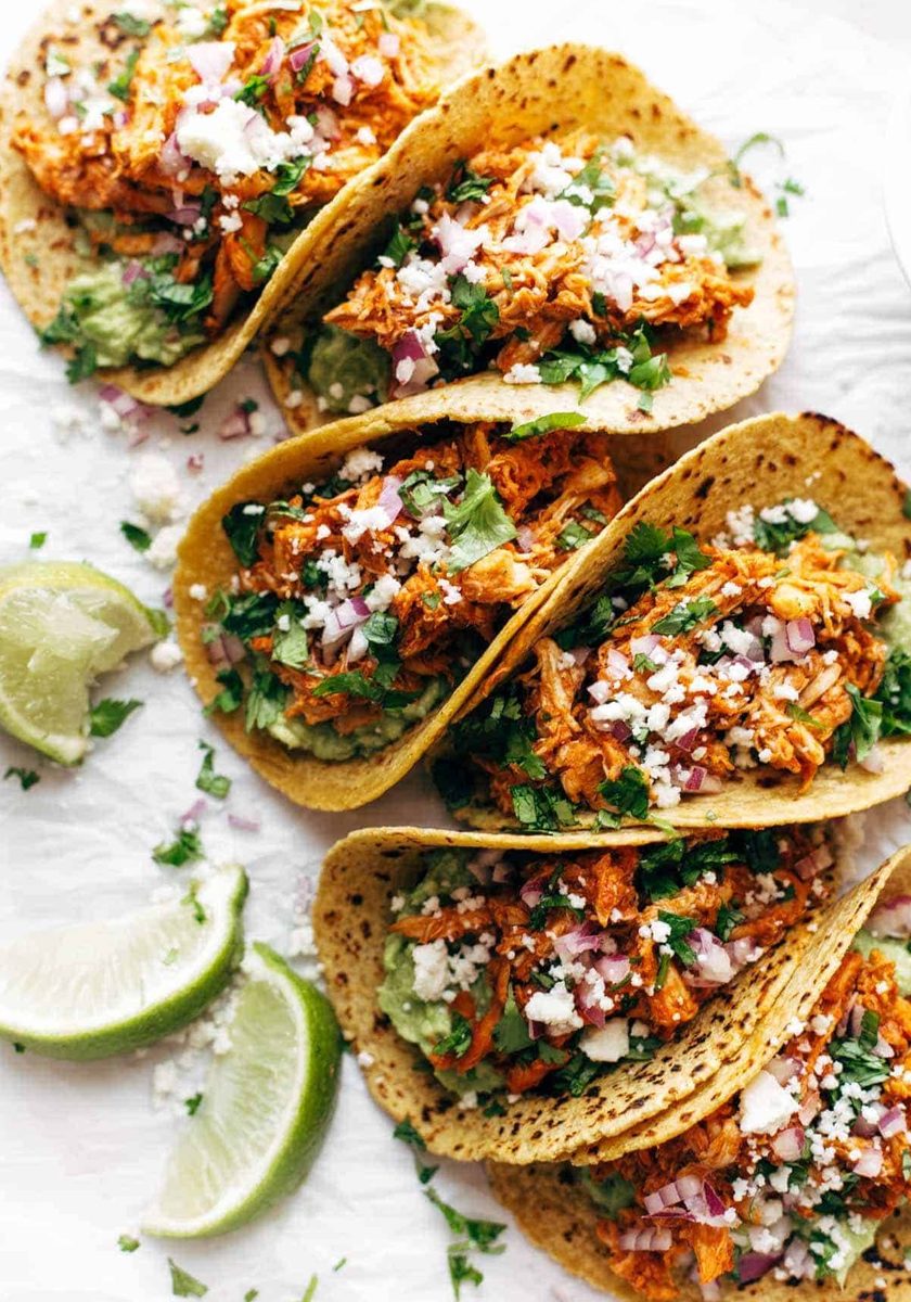 Chicken Tinga Tacos in a row.