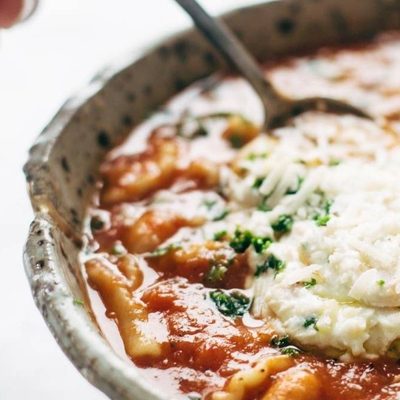 White Bean Lasagna Soup in a bowl with a spoon.