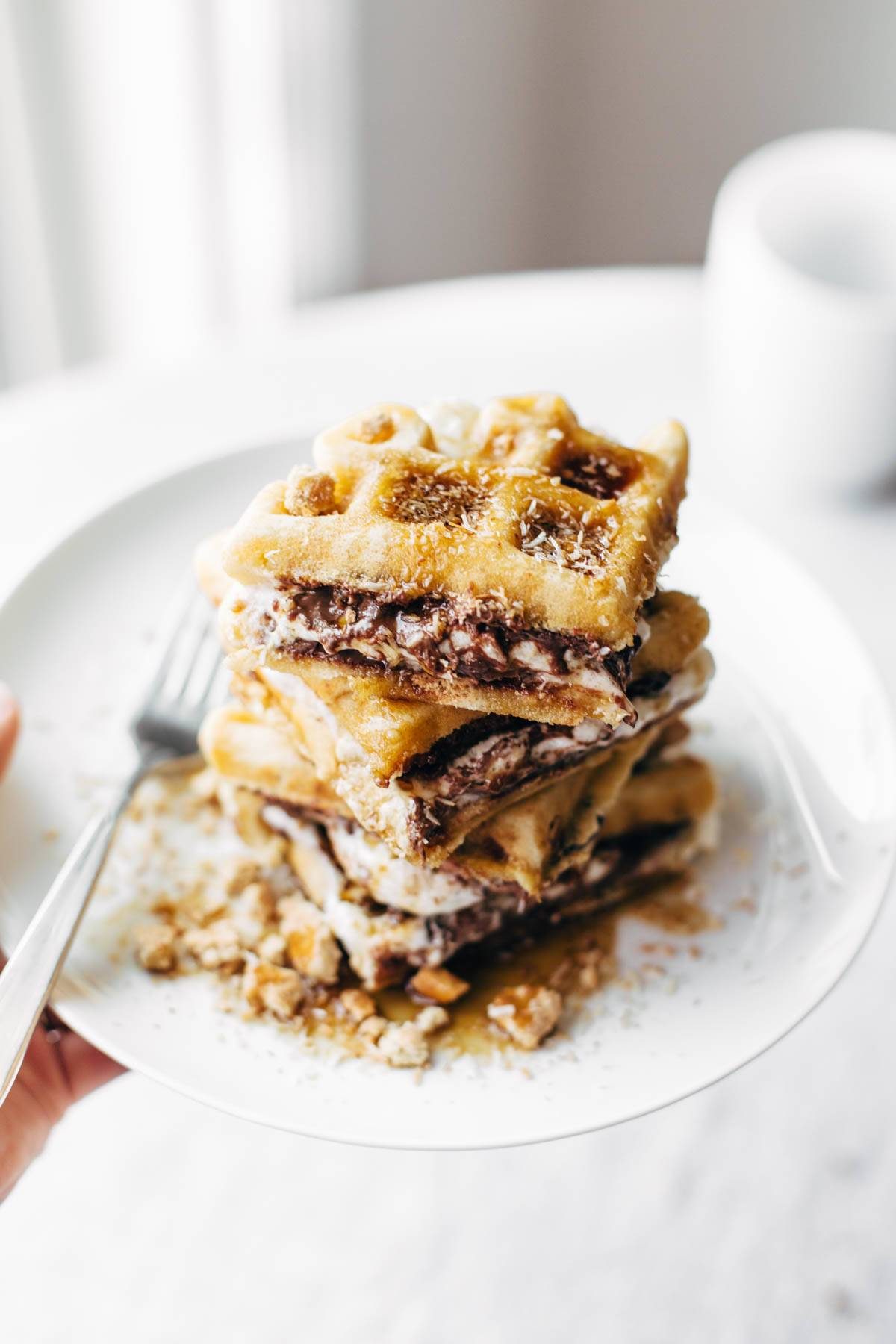 Smores Waffles with Nutella and Toasted Coconut on a plate with a fork