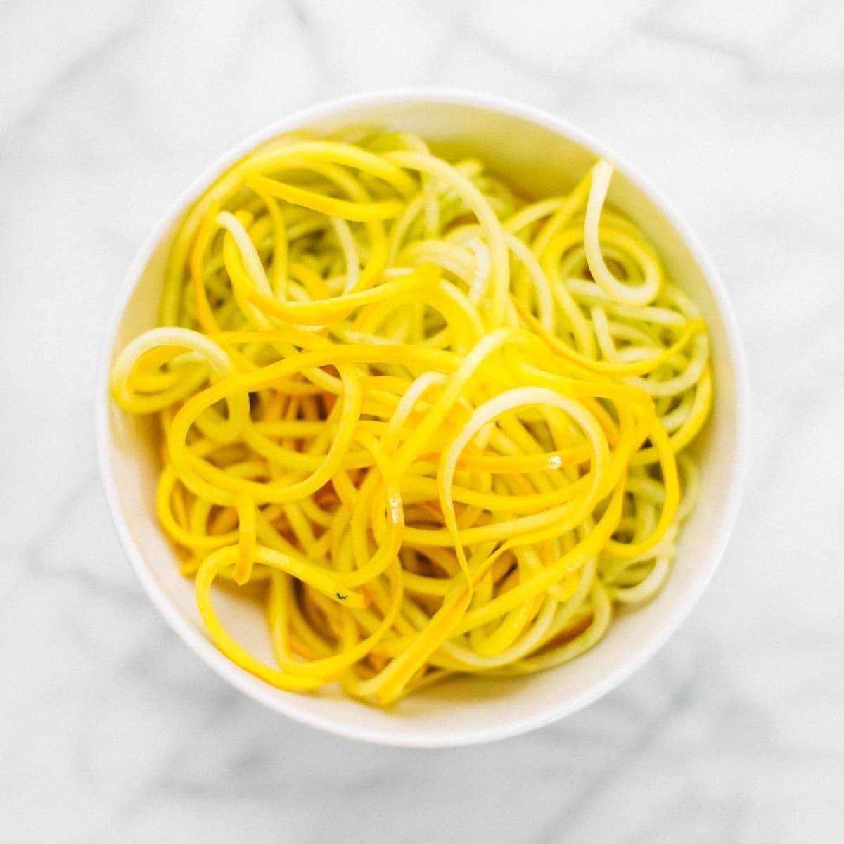 A spiraled zucchini in a bowl.