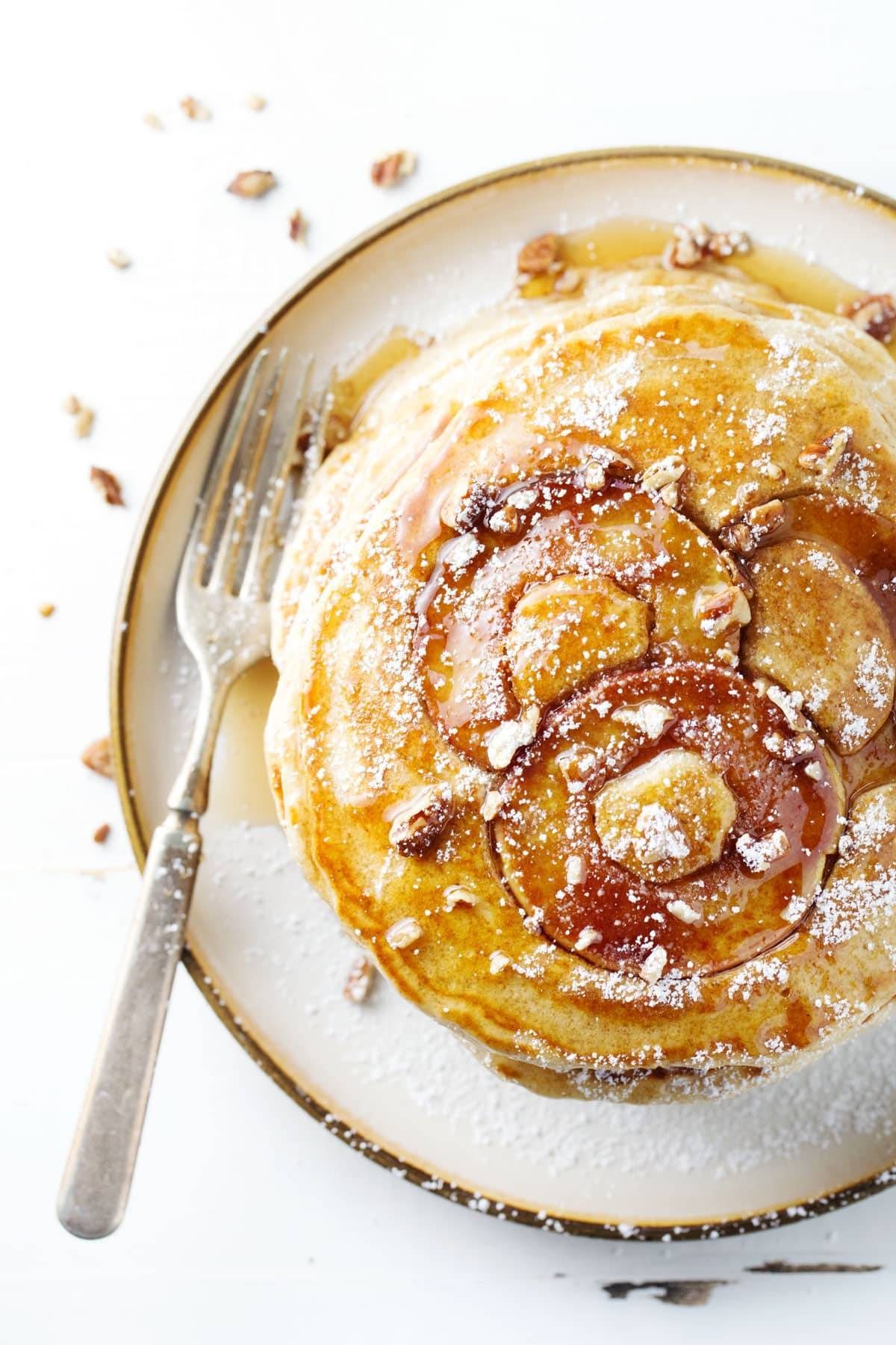 Apple Pancake on a plate with a fork.
